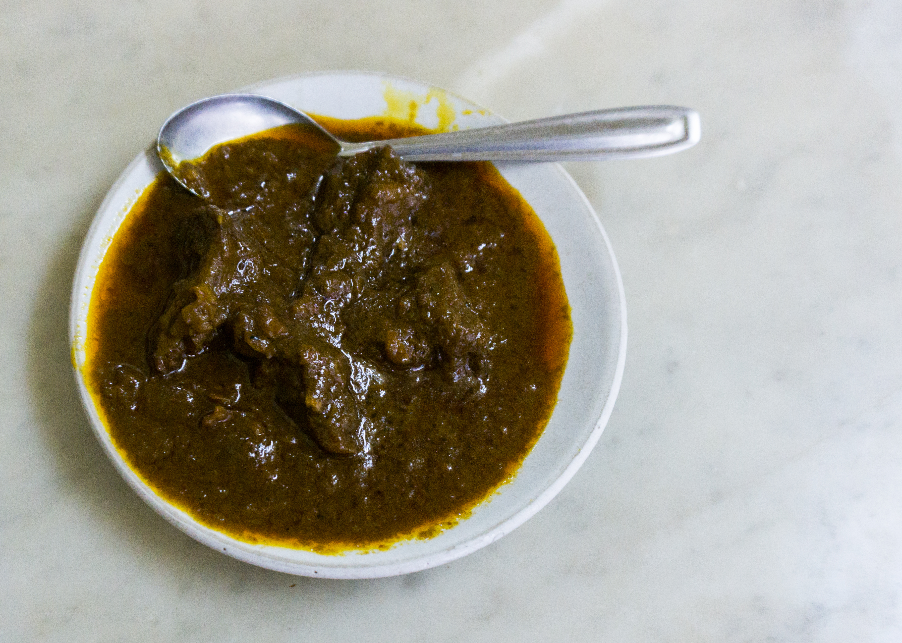 Traditional Kosha Mangsho dish from West Bengal, India — Authentic recipe from Eat By State