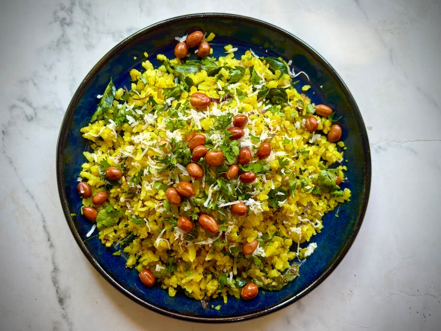 Traditional Poha dish from Maharashtra, India — Authentic recipe from Eat By State